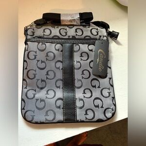 NEW- G logo Crossbody- 
Black- Silver Hardware
Stylish practical handbag